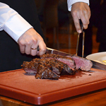 Cutting the steak, Brunelli’s Steakhouse